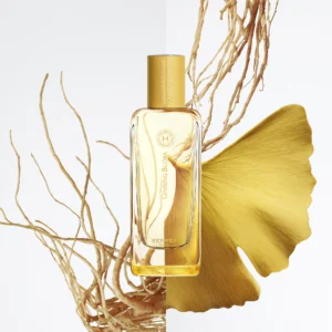 Hermès Ginseng Biloba perfume bottle with ginseng roots and a yellow ginkgo biloba leaf