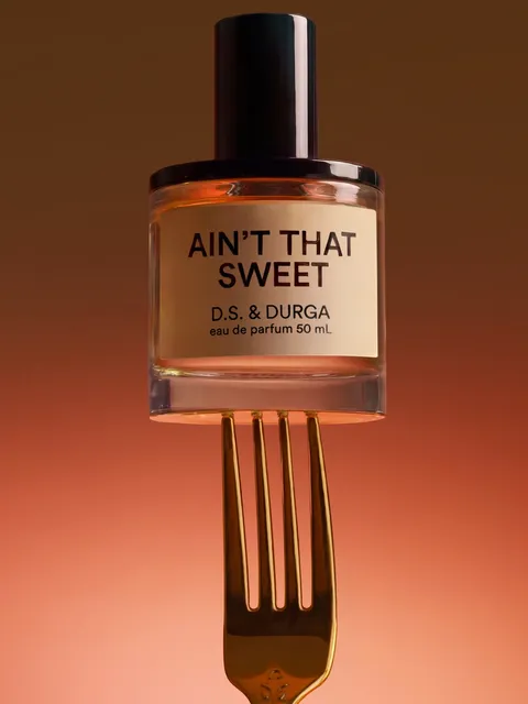 D.S. & Durga Ain’t That Sweet perfume bottle balanced on a gold fork
