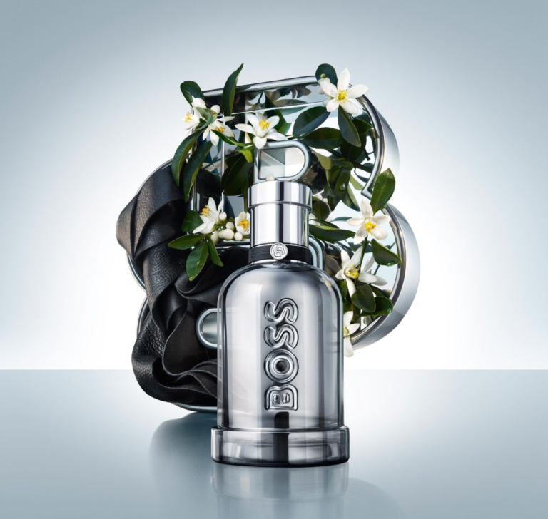BOSS Bottled Beyond Intense bottle with orange blossom flowers and black leather