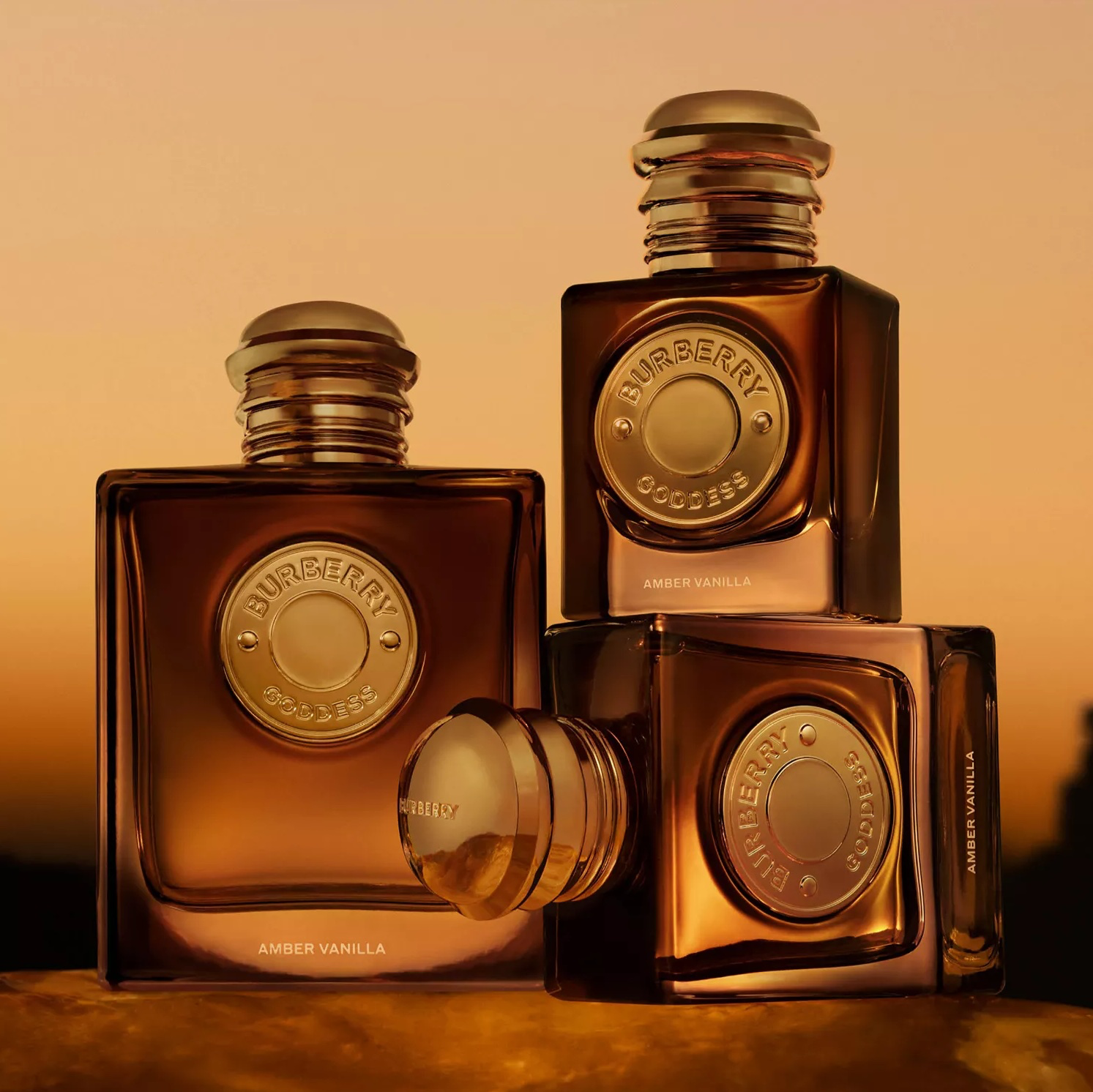 Burberry Goddess Amber Vanilla 2026 perfume bottles in amber sunset tones