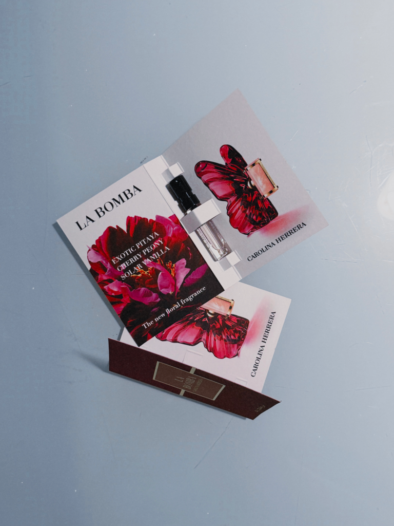 Carolina Herrera La Bomba perfume sample cards with vial, showing exotic pitaya, cherry peony and solar vanilla notes
