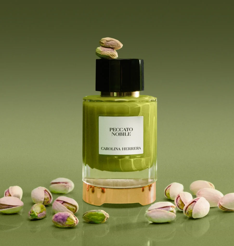 Carolina Herrera Peccato Nobile perfume surrounded by pistachios