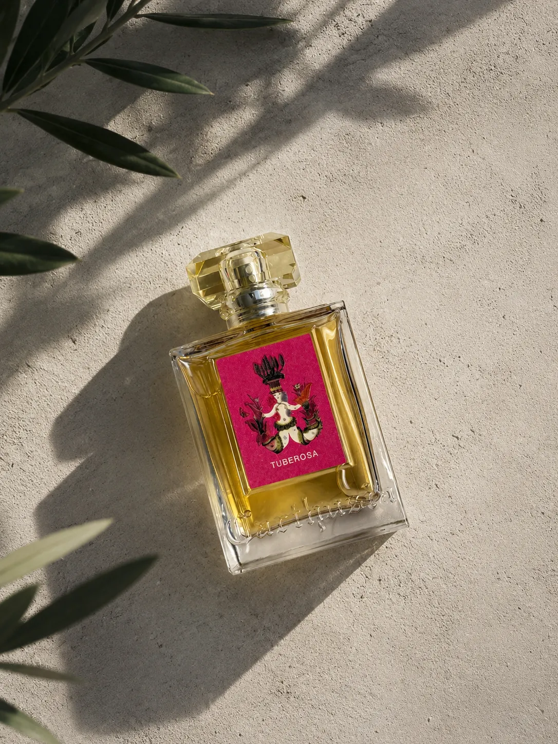 Carthusia Tuberosa Eau de Parfum bottle on a textured stone surface in warm sunlight