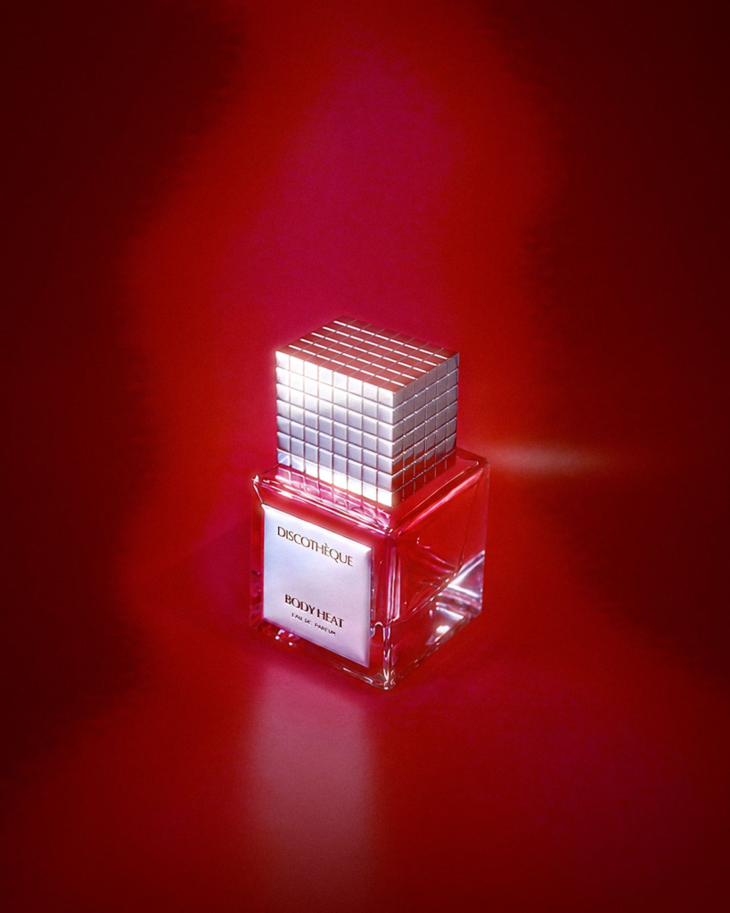 Discothèque Body Heat perfume bottle in red light