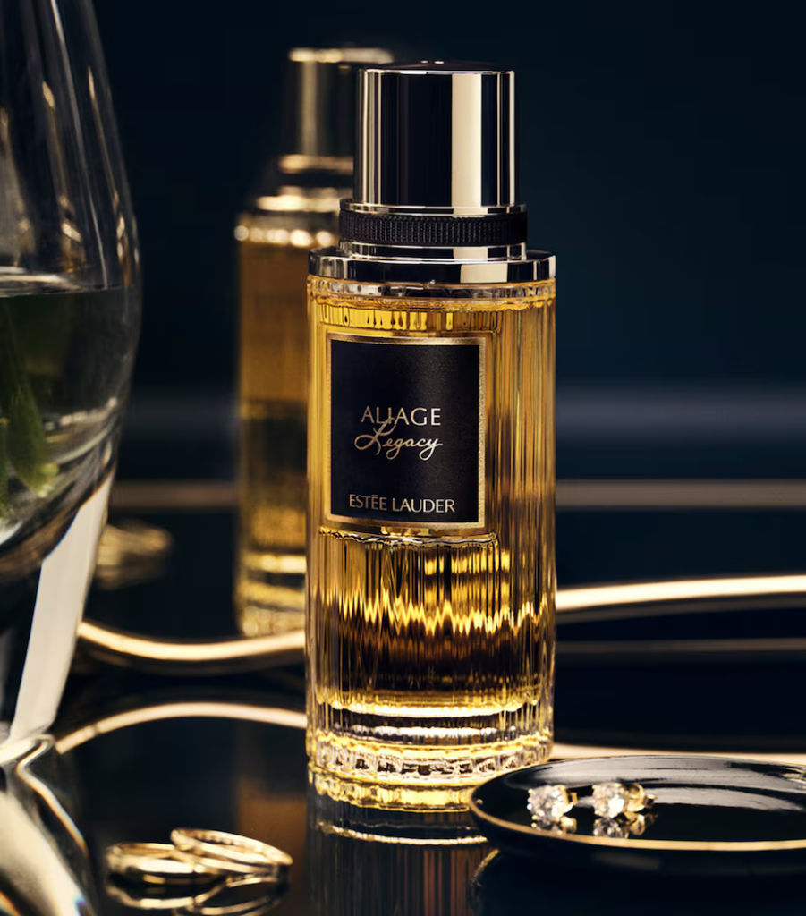Estée Lauder Aliage Legacy perfume bottle in dark gold setting