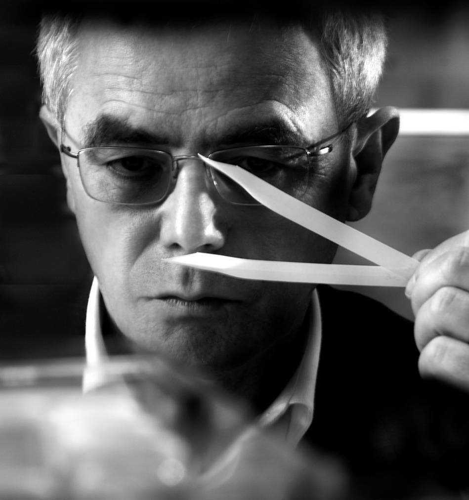 François Demachy, former Dior Perfumer-Creator, smelling a fragrance blotter