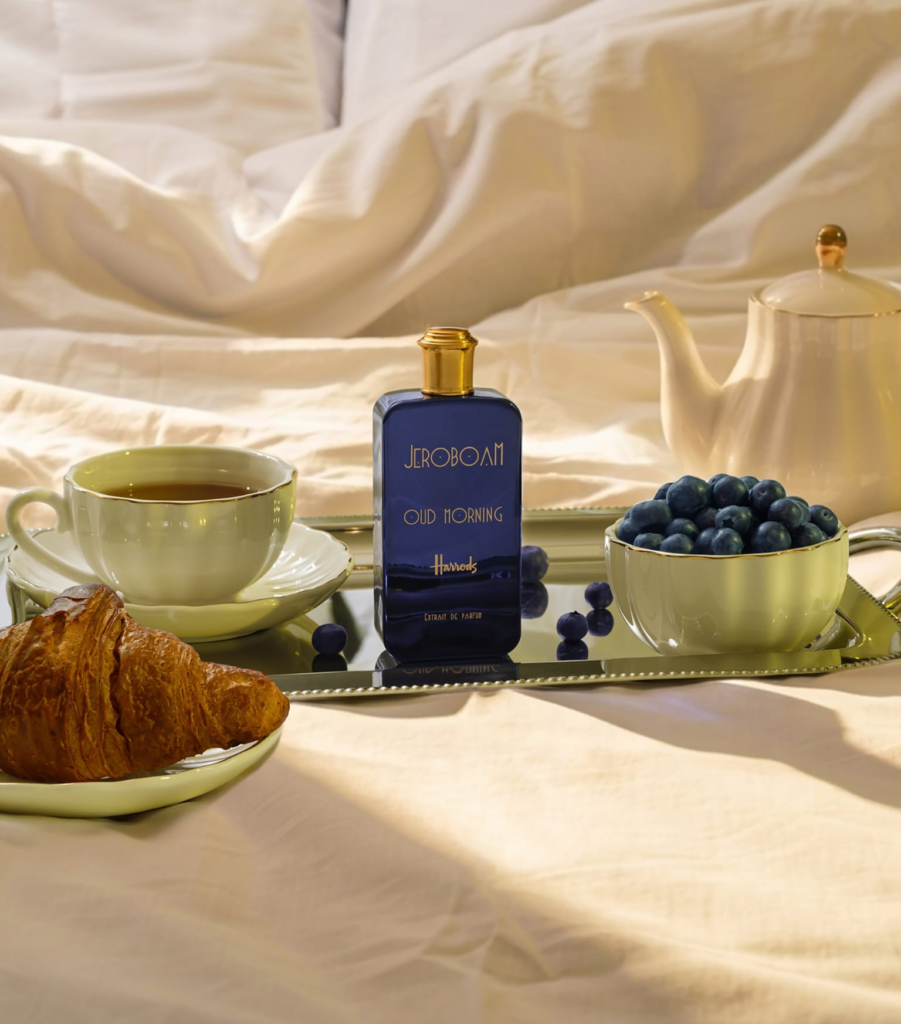 Jeroboam Oud Morning bottle styled on a breakfast tray with tea, croissant and blueberries.