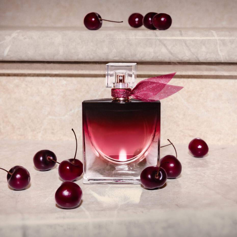 Lancôme La Vie Est Belle Very Cherry perfume bottle surrounded by dark cherries