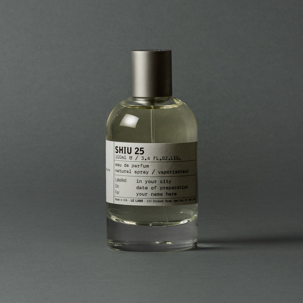 Le Labo Shiu 25 Eau de Parfum bottle against a dark grey background.