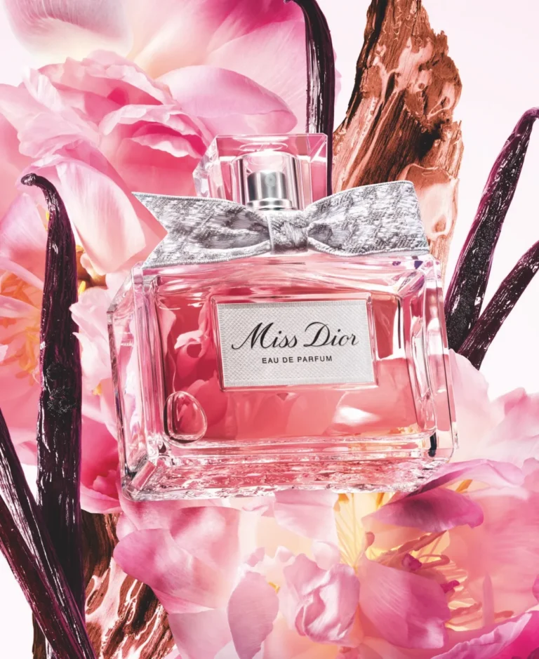 Miss Dior Eau de Parfum 2026 bottle surrounded by pink flowers and painted vanilla pods