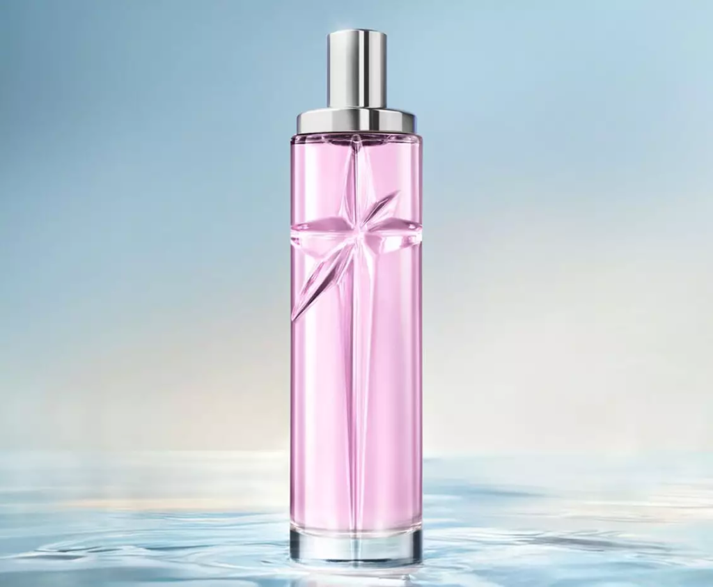 Pink Mugler Starlicious Berry Licorice bottle on a blue background