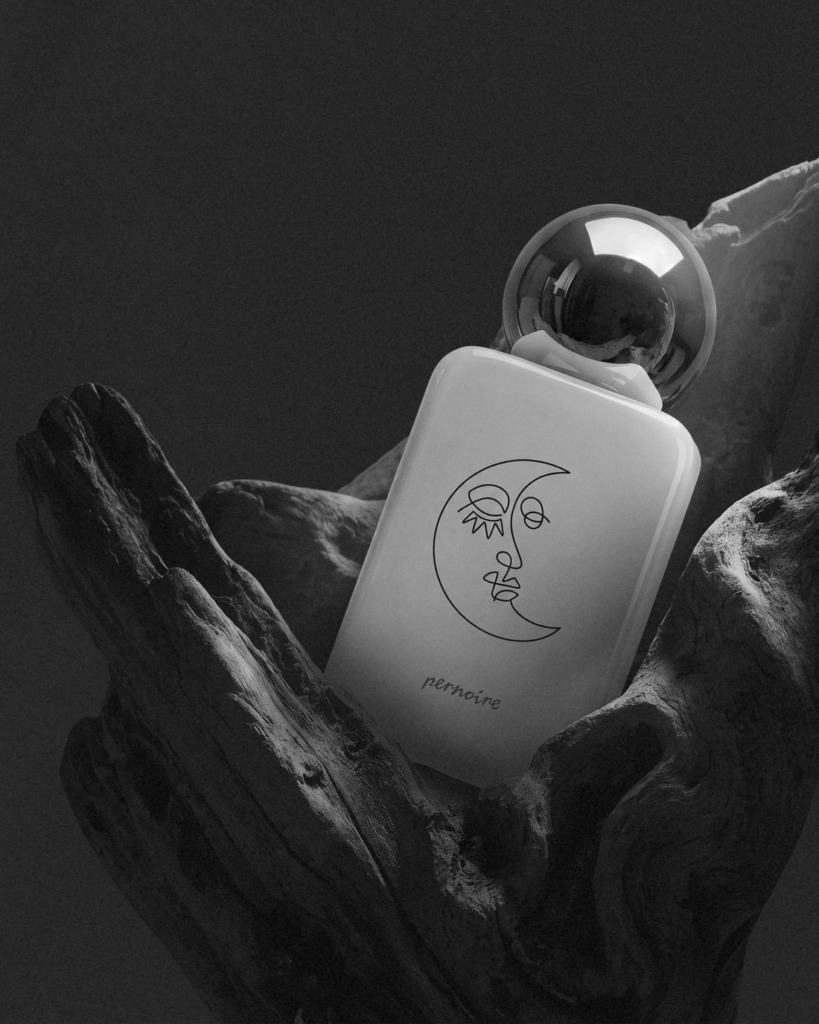 Pernoire Luvani bottle in a dark nocturnal setting