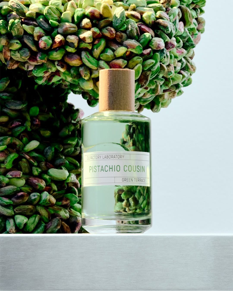 Pistachio Cousin by Liquides Imaginaires beside a sculptural display of pistachios