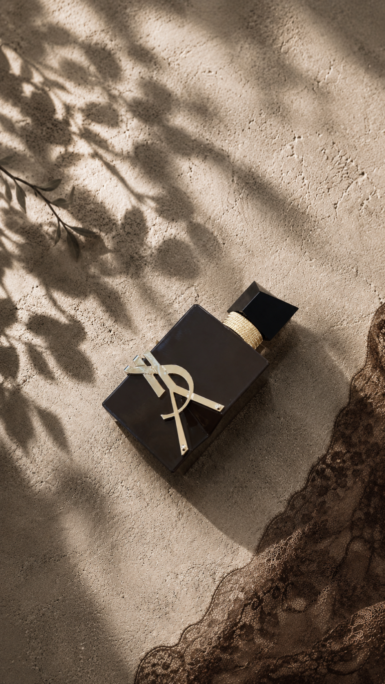 YSL Libre Santal Couture review with the brown bottle in a warm editorial setting