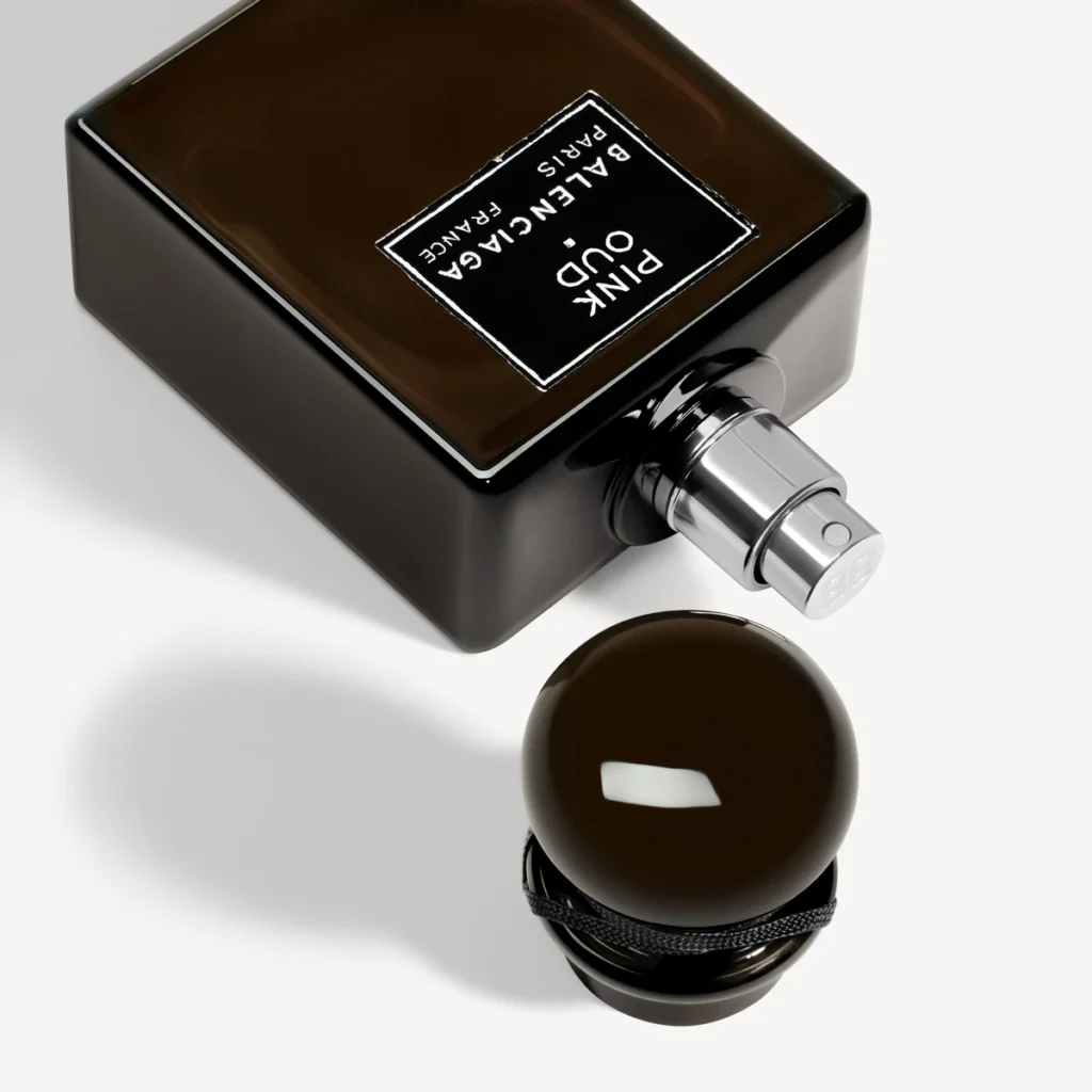 Close-up of the Balenciaga Pink Oud label, silver atomiser and rounded dark cap.