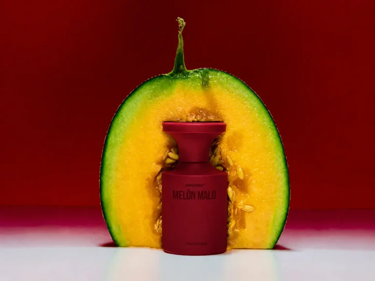 BORNTOSTANDOUT Melon Malo perfume bottle with a sliced green melon