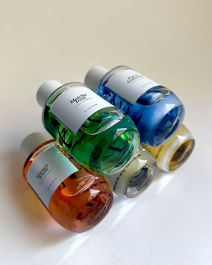 Colourful Élixir Privé perfume bottles including Matcha Irozi, Encre Galuchat and Mango White.