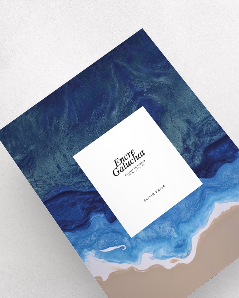 Élixir Privé Encre Galuchat presentation box with a blue marbled design.