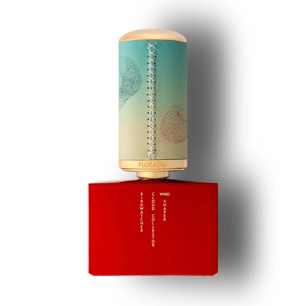 Back of the red Floraïku Birdwatcher bottle with a turquoise, cream and gold cap