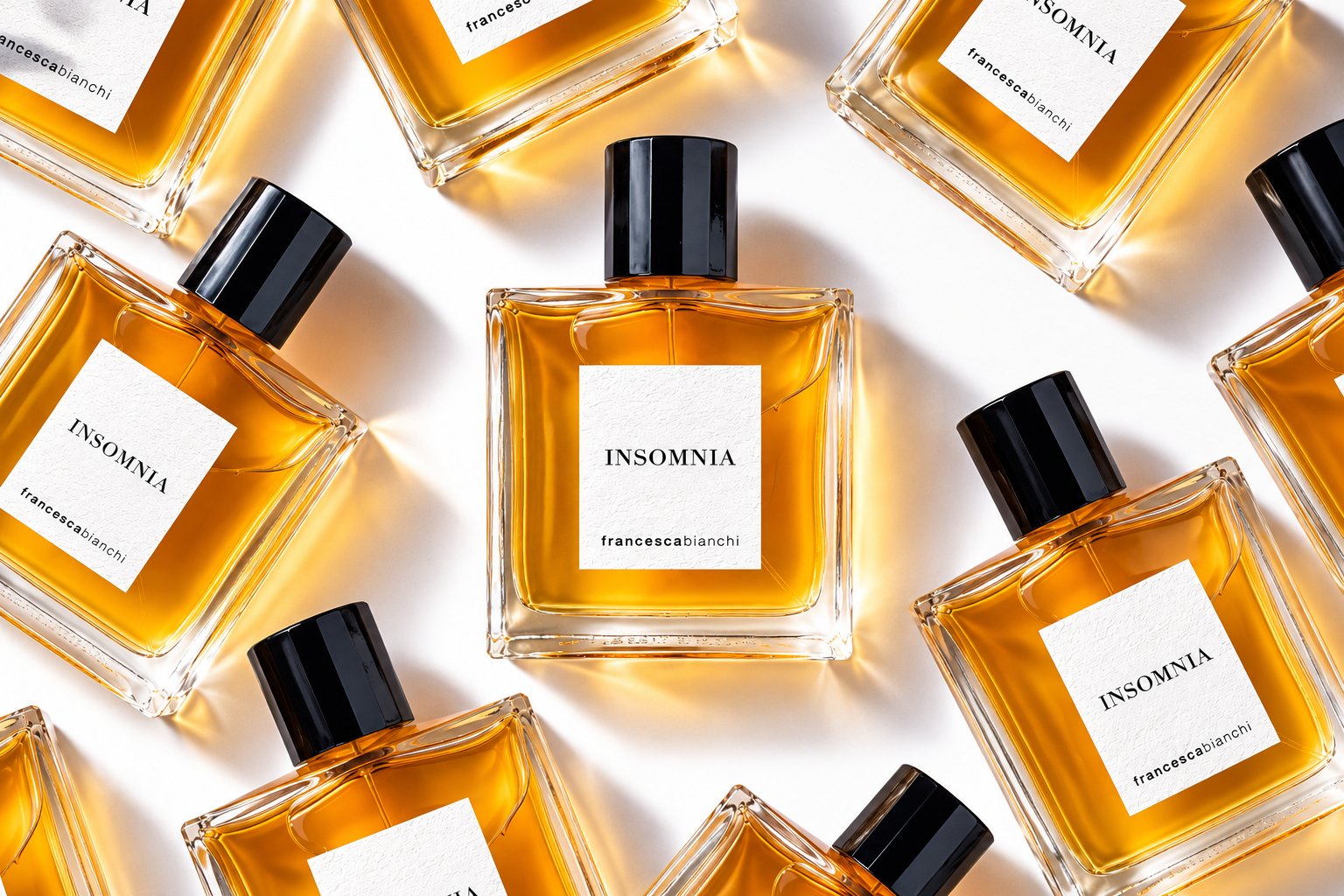 Francesca Bianchi Insomnia Extrait de Parfum bottles arranged in an editorial pattern