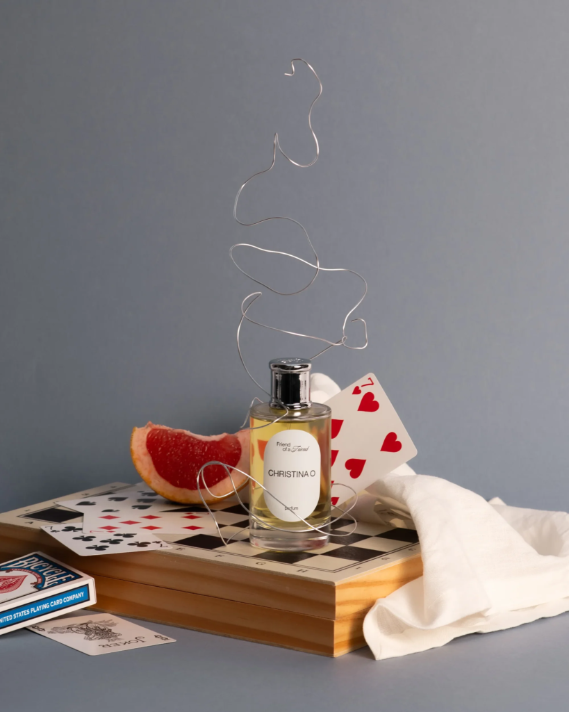 Friend of a Friend Christina O perfume with grapefruit and playing cards