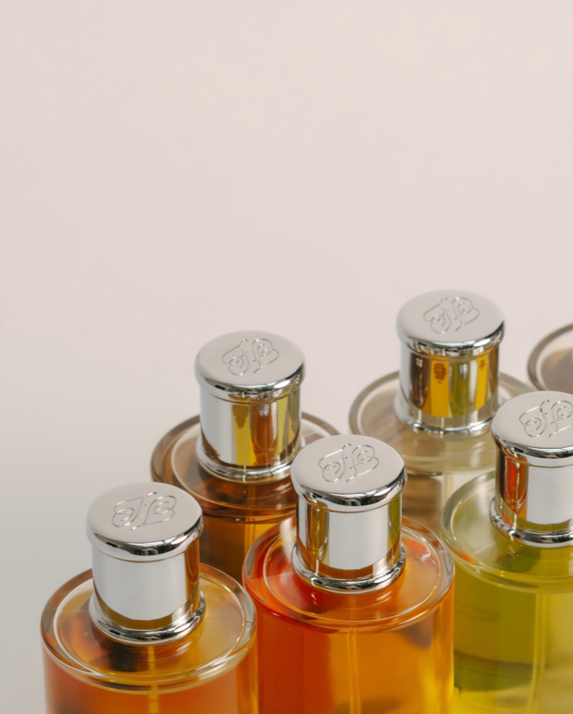 Close-up of Friend of a Friend perfume bottles and silver caps