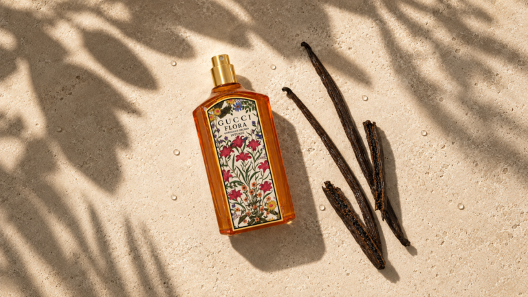 Gucci Flora Gorgeous Orchid Intense bottle beside vanilla pods