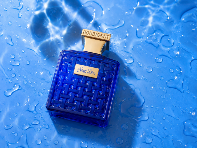 Houbigant Néroli Bleu perfume bottle on a blue water surface