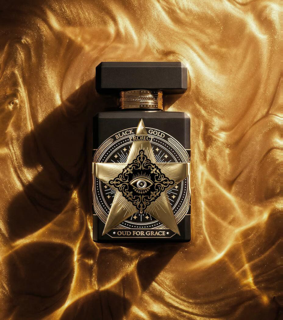 Initio Oud for Grace bottle resting on shimmering gold satin