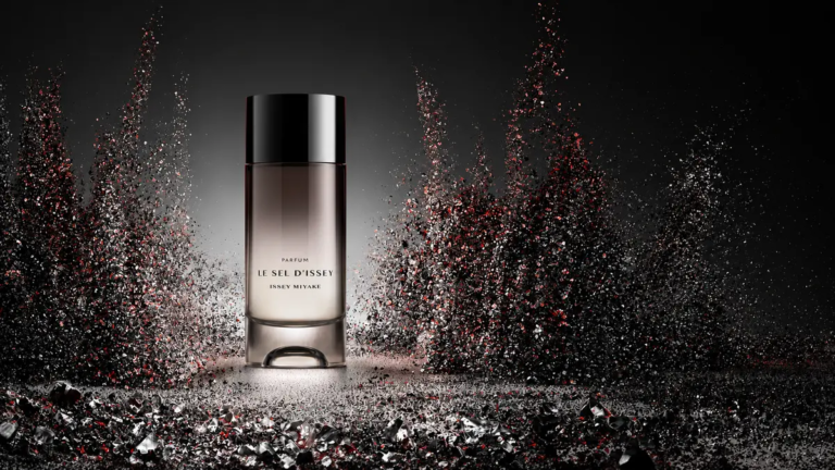 Issey Miyake Le Sel d'Issey Parfum bottle surrounded by black mineral crystals