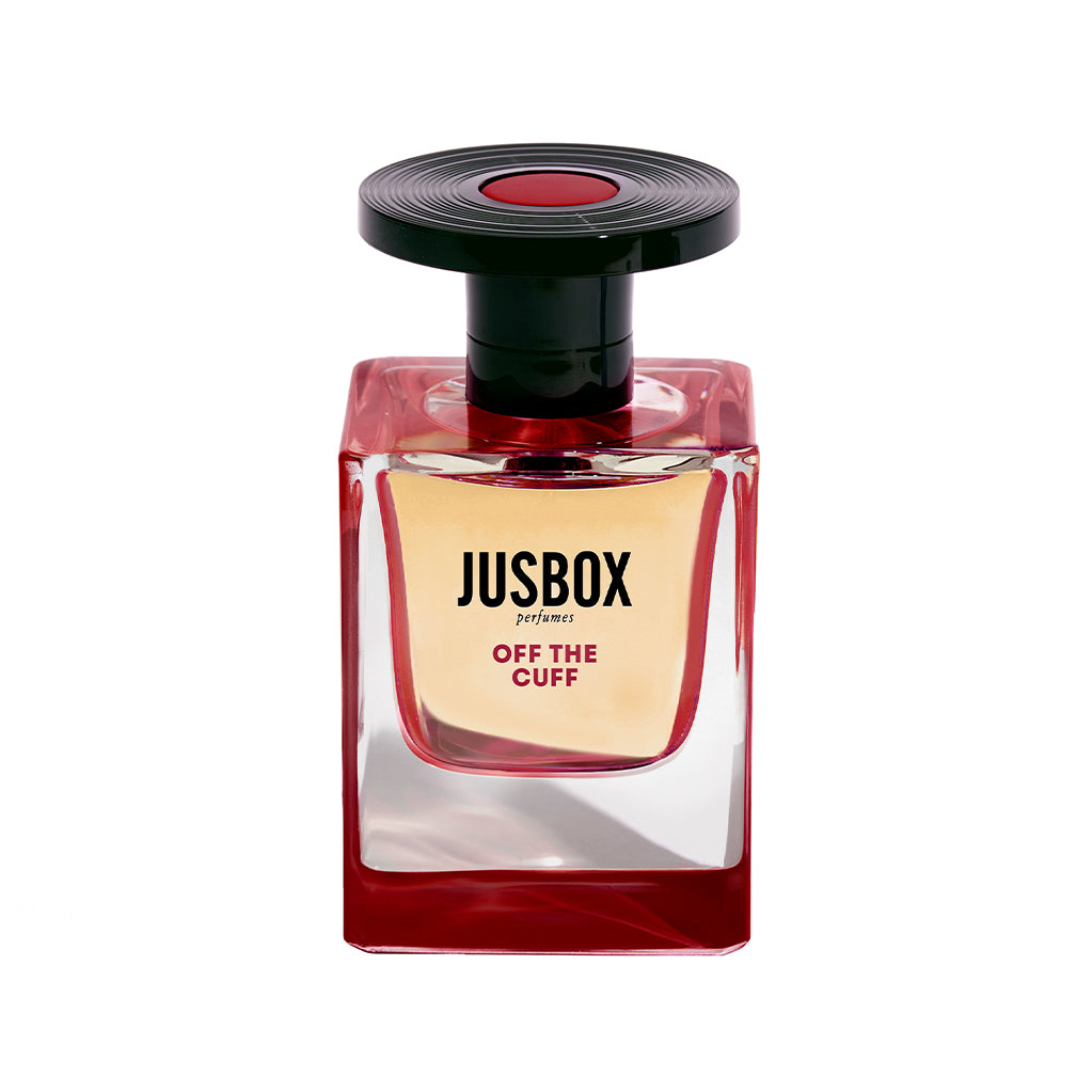 JUSBOX Off the Cuff Eau de Parfum bottle with red glass and record-shaped cap