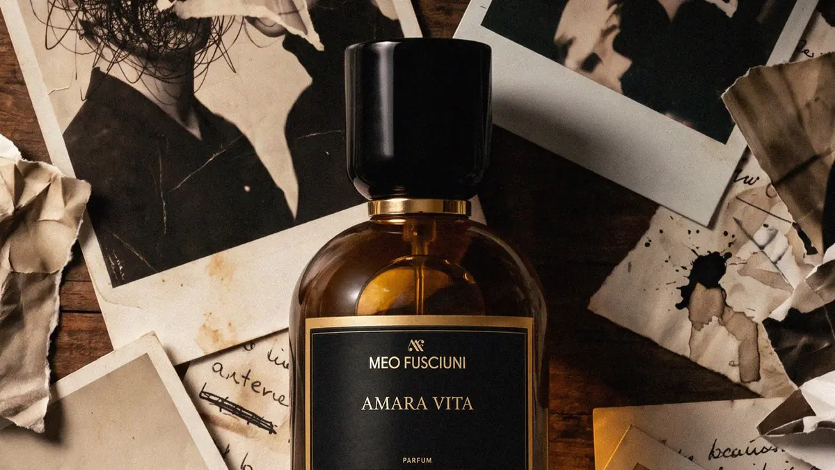 Meo Fusciuni Amara Vita bottle among torn photographs and handwritten notes