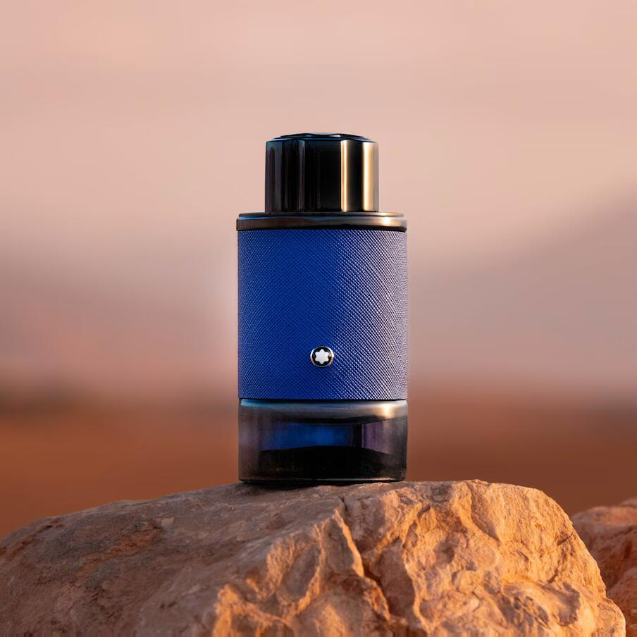 Montblanc Explorer Infinite blue perfume bottle displayed on a rock