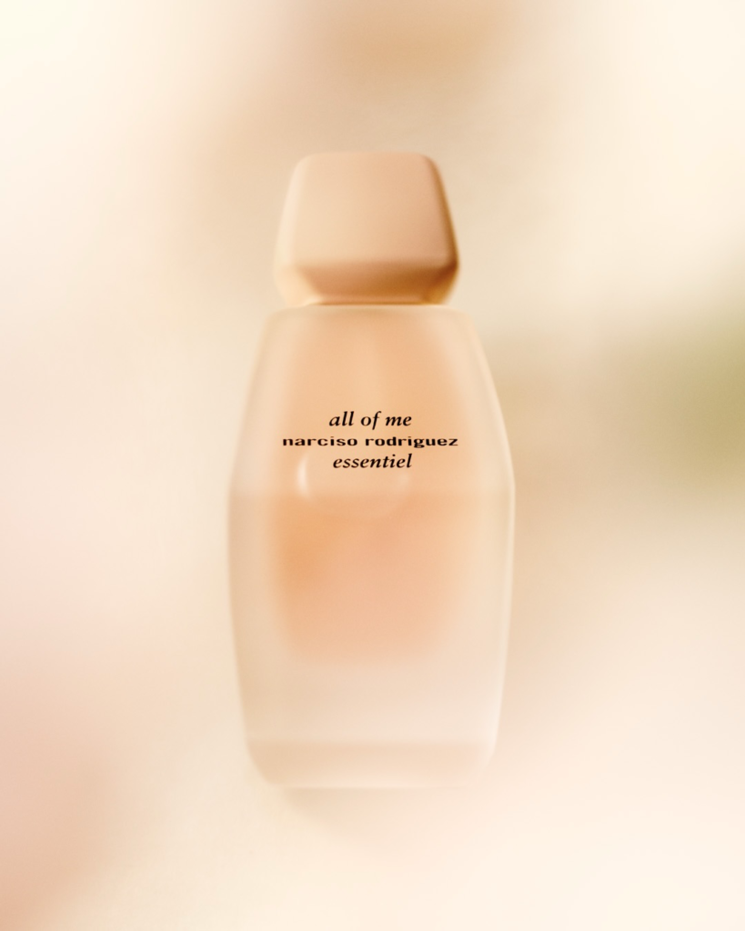 Soft-focus, blurred shot of the Narciso Rodriguez All of Me Essentiel bottle