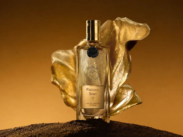 Nicolaï Patchouli Spirit Eau de Parfum Intense bottle with a golden leaf and dark earth