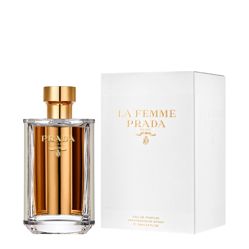 La Femme Prada Eau de Parfum bottle next to its white presentation box
