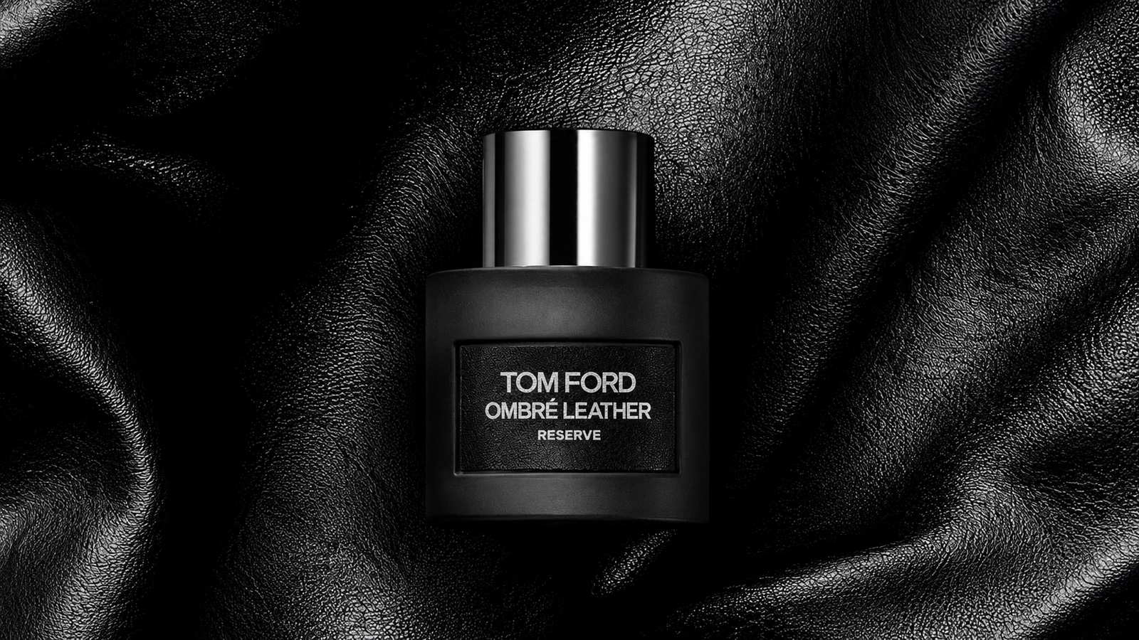 Tom Ford Ombré Leather Reserve bottle on black leather
