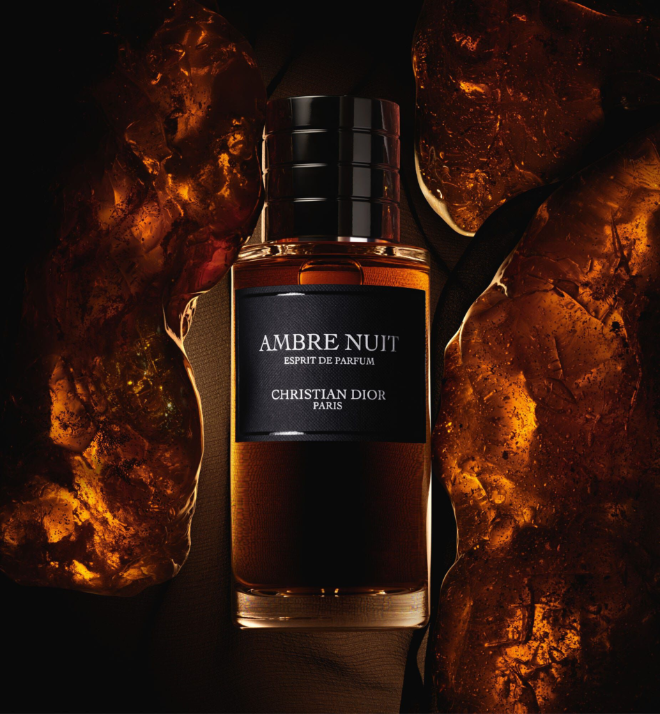 Ambre Nuit Esprit de Parfum bottle with amber background
