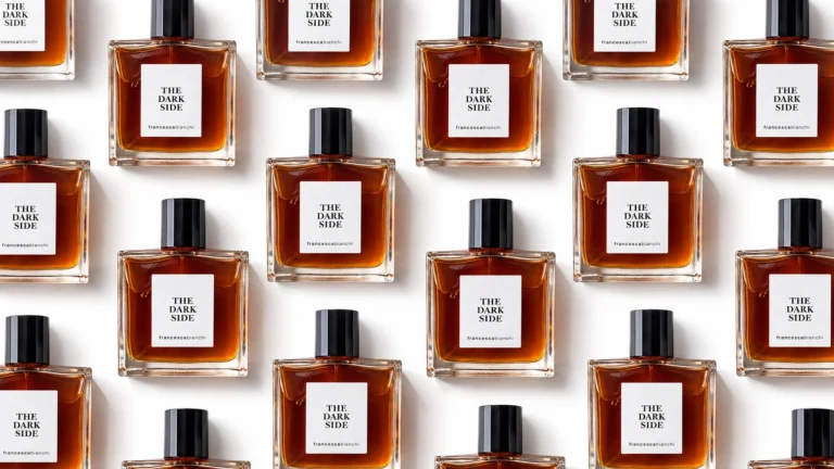 Francesca Bianchi The Dark Side perfume bottles arranged in a staggered repeating pattern against a white background.