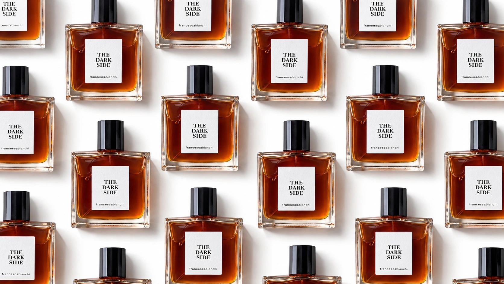Francesca Bianchi The Dark Side perfume bottles arranged in a staggered repeating pattern against a white background.