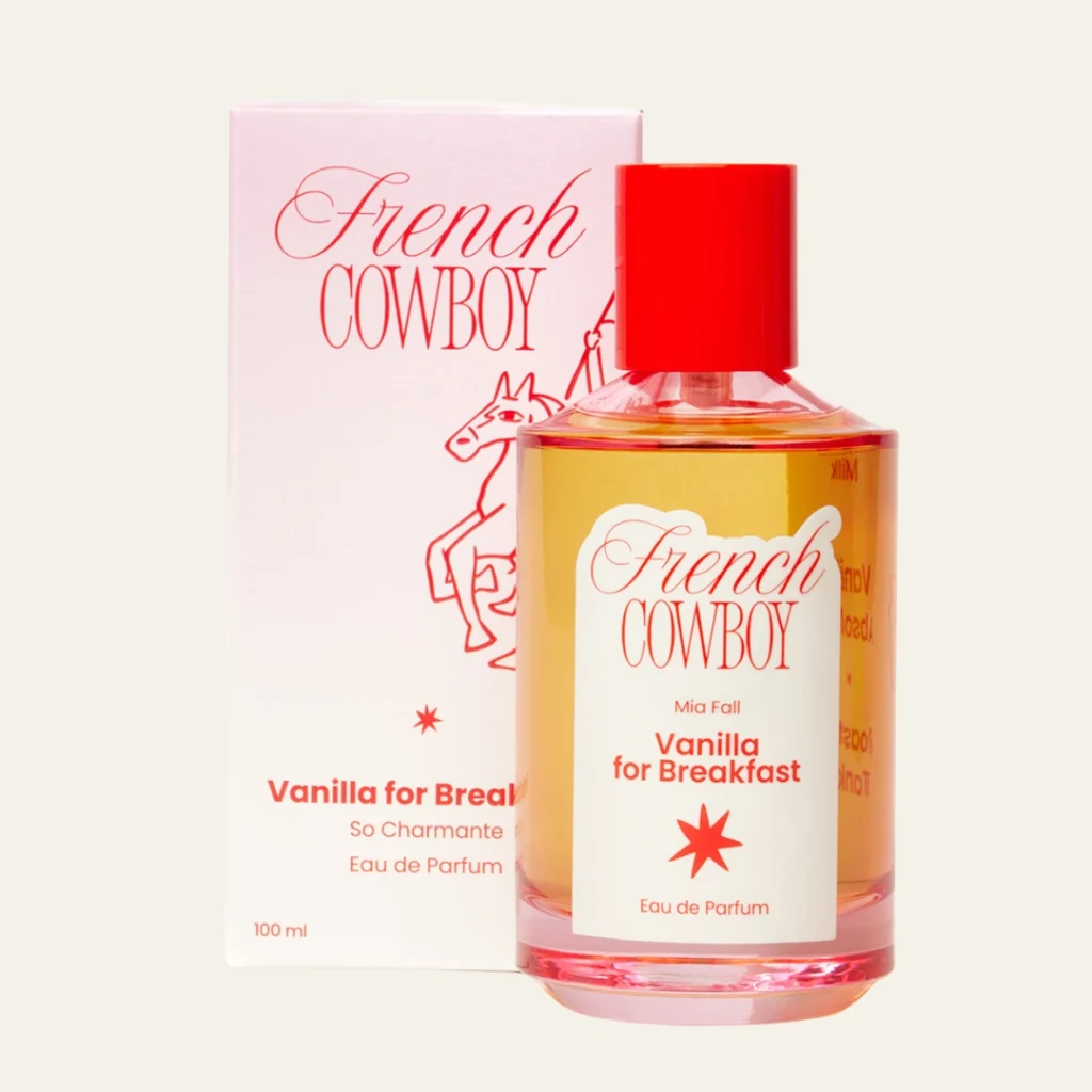 French Cowboy Vanilla for Breakfast Eau de Parfum bottle displayed beside its illustrated pink and red packaging.
