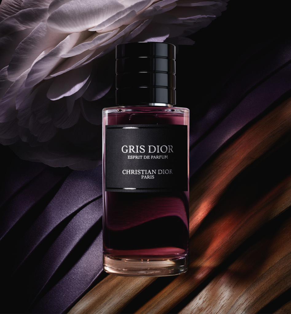 Gris Dior Esprit de Parfum bottle with dark violet petal background