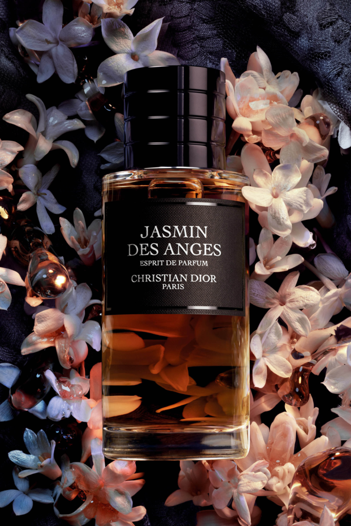 Jasmin des Anges Esprit de Parfum bottle surrounded by jasmine flowers