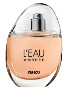 Kenzo L'Eau Ambrée perfume bottle with a rounded transparent glass design, soft amber-pink fragrance and black lettering.