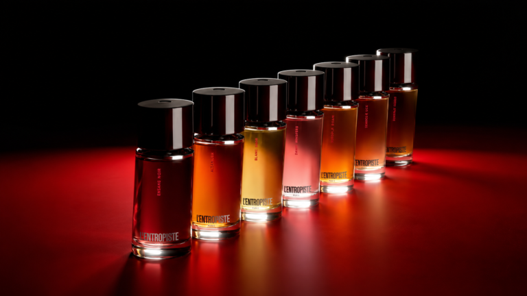 L'Entropiste perfume collection arranged against a black and red background