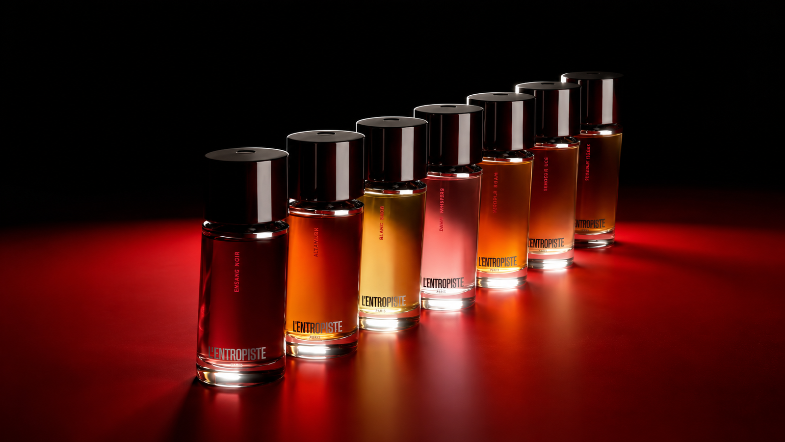 L'Entropiste perfume collection arranged against a black and red background