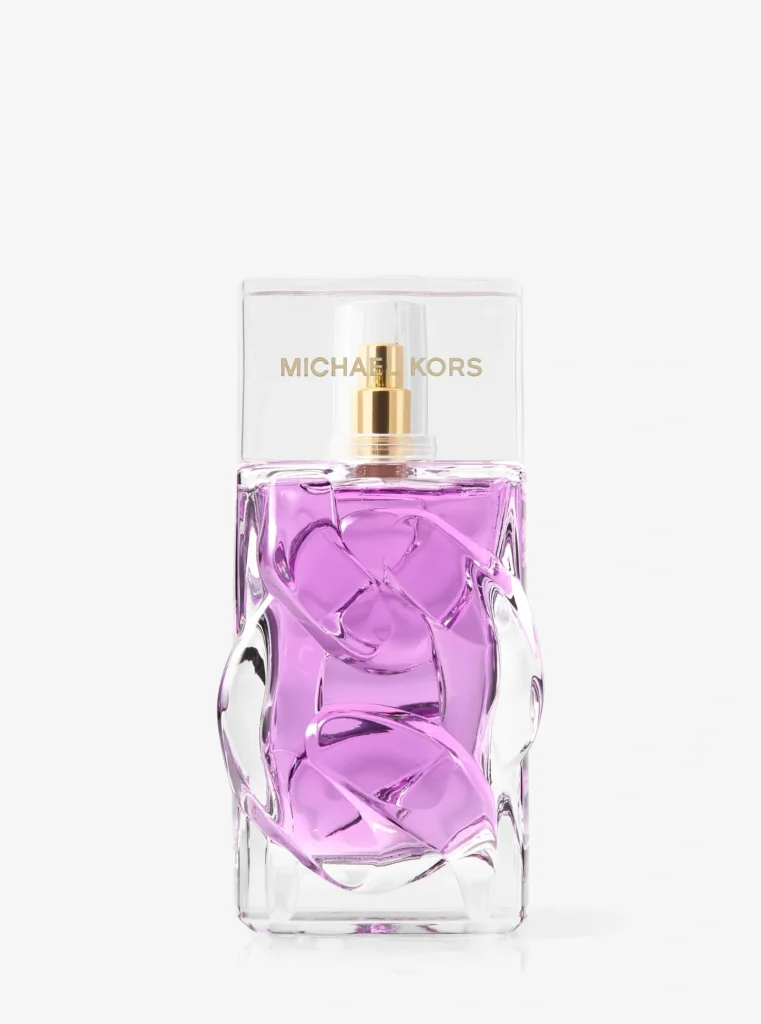 Michael Kors Violet Sunset Eau de Parfum bottle with sculptural glass details, purple liquid and a transparent cap.