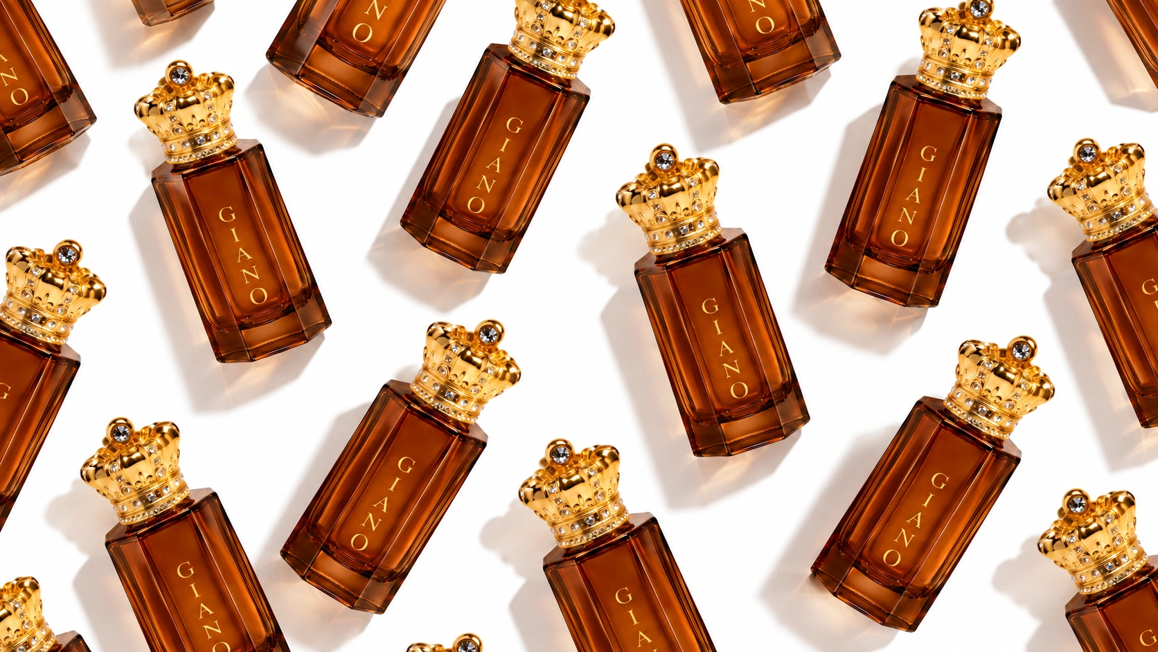 Royal Crown Giano perfume bottles with amber glass and golden crown caps arranged in a diagonal repeating pattern on a white background.
